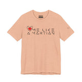 Beige t-shirt with 'Love Me Like a Martian' text and logo on a white background