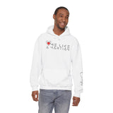 Man wearing a light blue hoodie with a graphic design on a white background