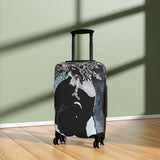Suitcase with artistic design on a wooden floor and light green wall