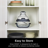 Ninja CRISPI food storage container in a kitchen cabinet with text 'Easy to Store'.