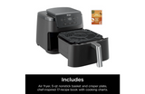 Ninja air fryer with a recipe book on a white background