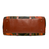 Brown leather bag with colorful patterned flap on a white background