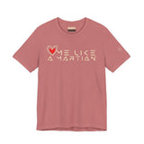 Pink t-shirt with 'Love Like a Martian' text and heart graphic on a white background