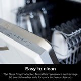 Dishwasher with open door showing dishes inside, with text about Ninja Crispi adapter and TempWare glassware.