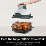 Ninja CRISPi PowerPod with roasted chicken wings on a white background