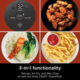 Ninja CRISPI PowerPod with air-fried chicken, rice and vegetables, and fries on a red background.